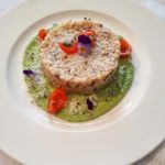 Fregula con crema di piselli e seppie